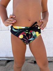 Sicilian-print swim trunks for boys - wheel and lemons